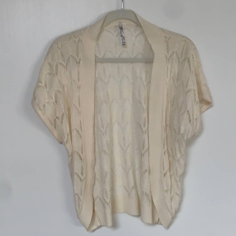 Beautiful and delicate cream colored short sleeve sweater. Never worn!